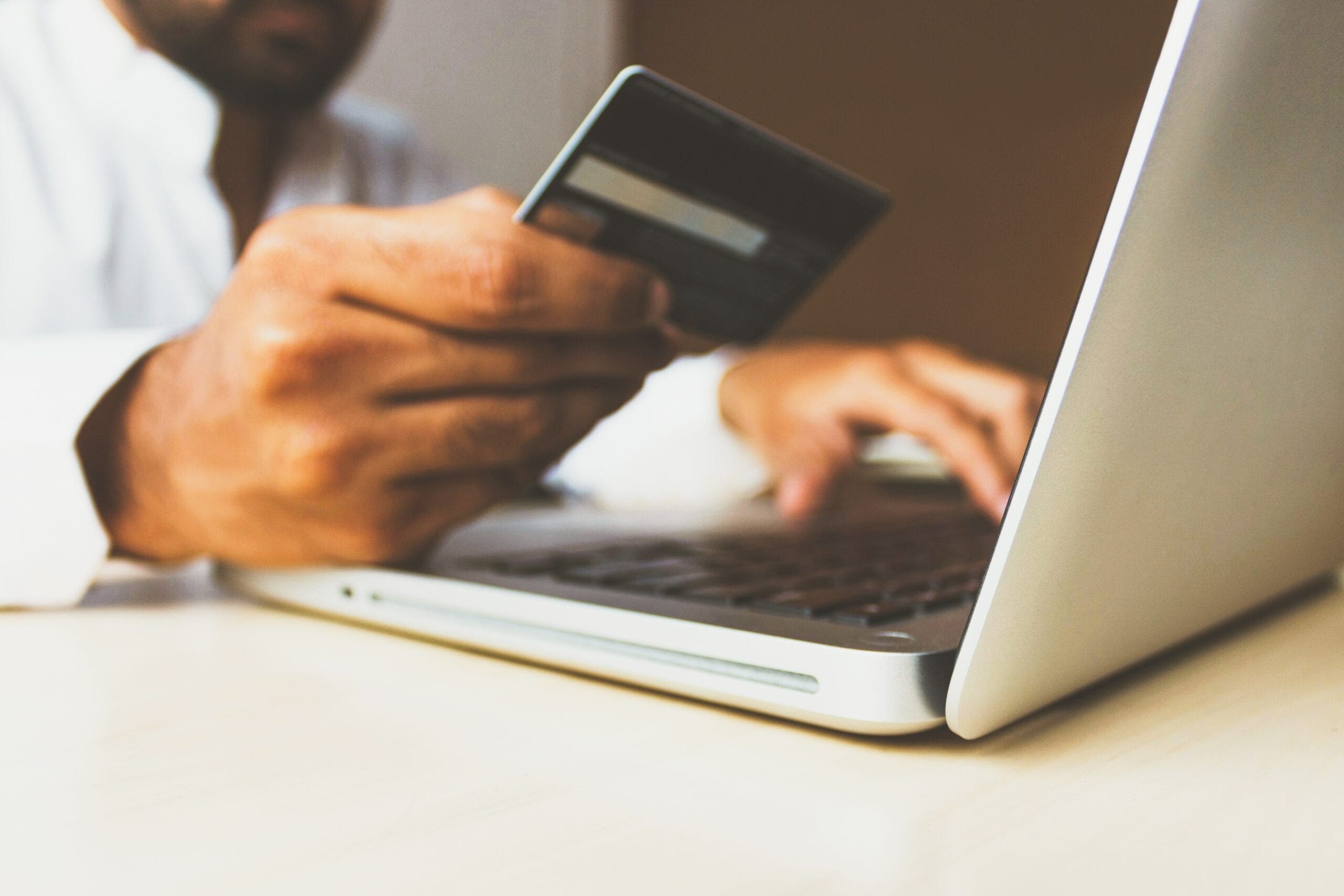 Man shopping online with credit card