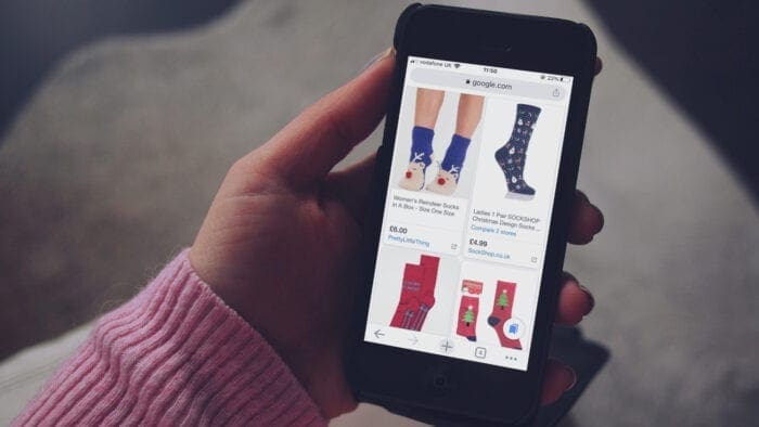 Woman using Google Shopping on iPhone